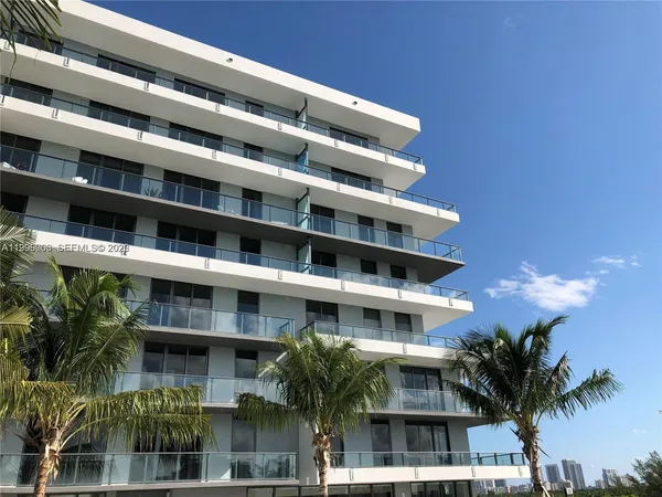 a view of a swimming pool with a patio and a garden