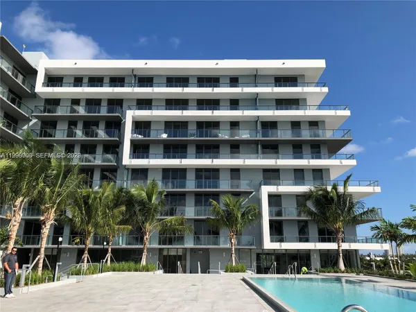 a kitchen with stainless steel appliances a refrigerator and a sink