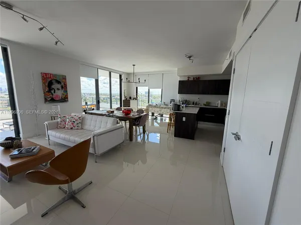 a view of gallery with wooden floor