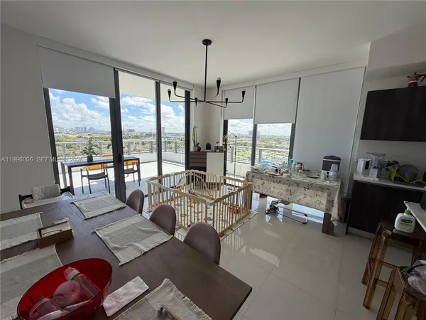 a kitchen with a table and chairs