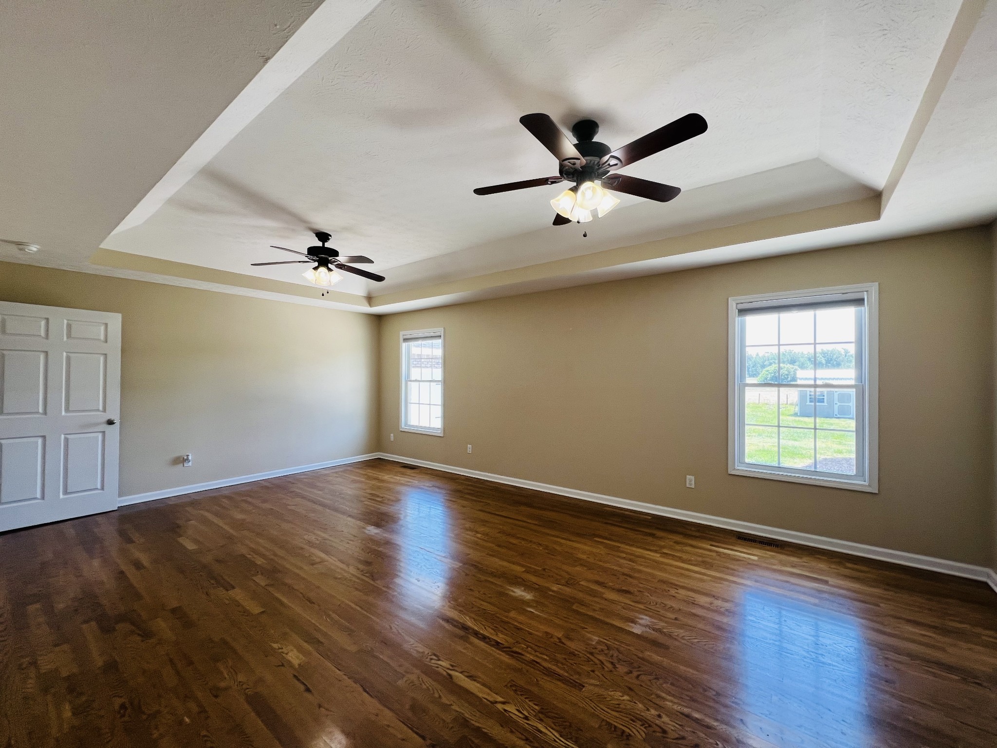 663 Jackson Road Portland, TN 37148 - Photo 22 of 32 a view of an empty room with wooden floor and a window