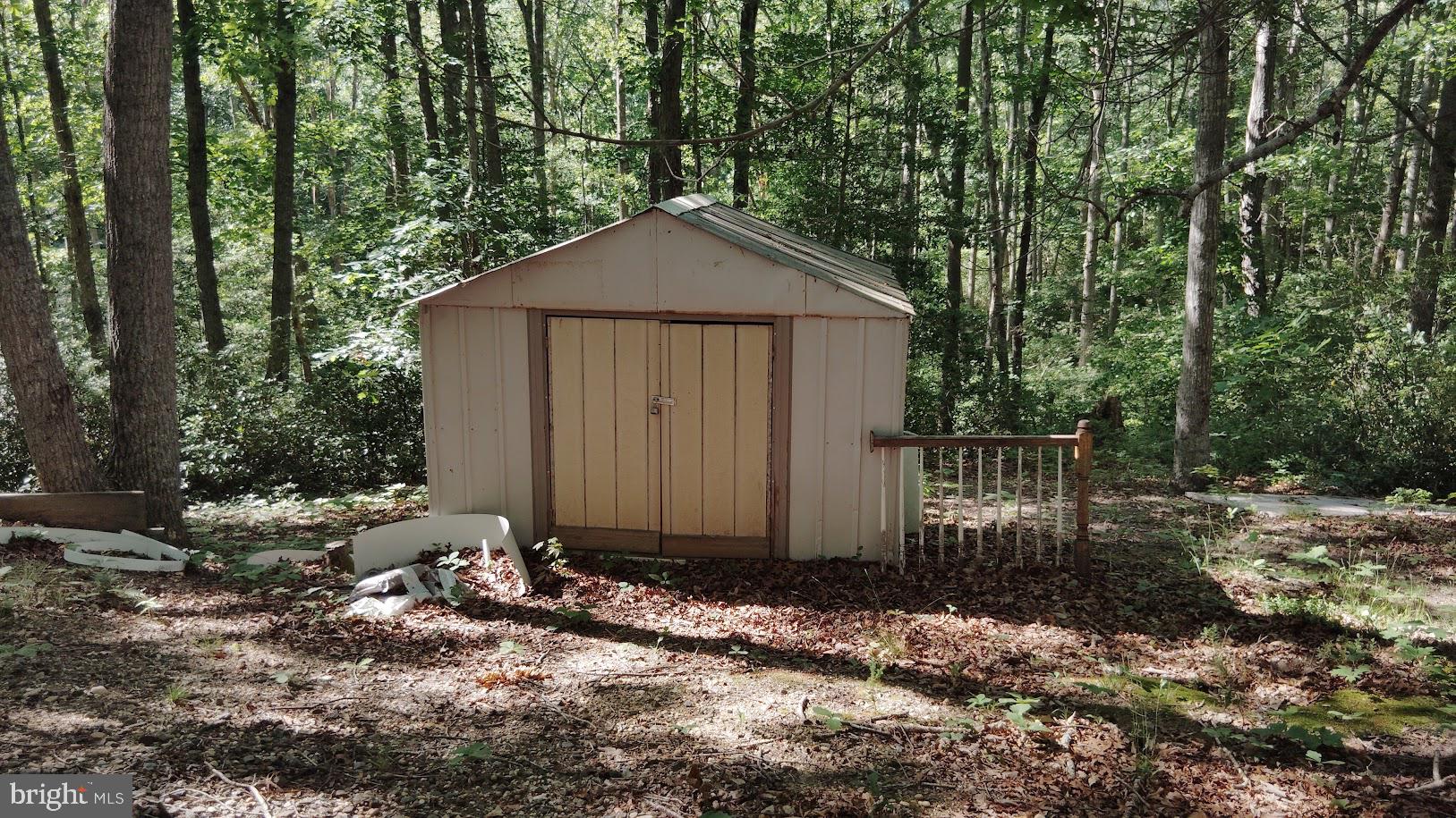 13025 Thunder Road King George, VA 22485 - Photo 9 of 34 Charming shed nestled in serene woods.