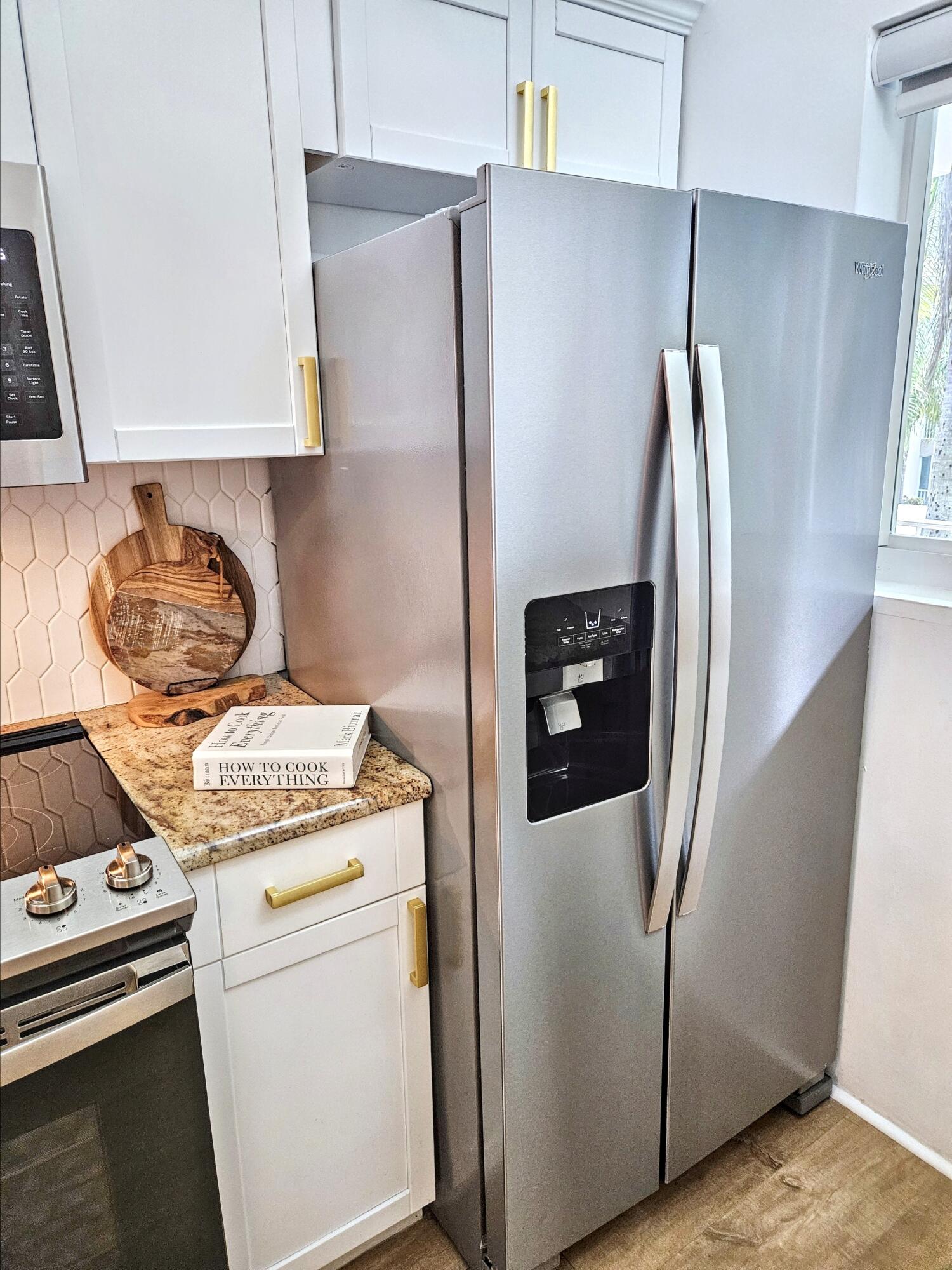 6530 North Ocean Boulevard, Unit 205 Ocean Ridge, FL 33435 - Photo 9 of 53 a kitchen with a stove and a refrigerator