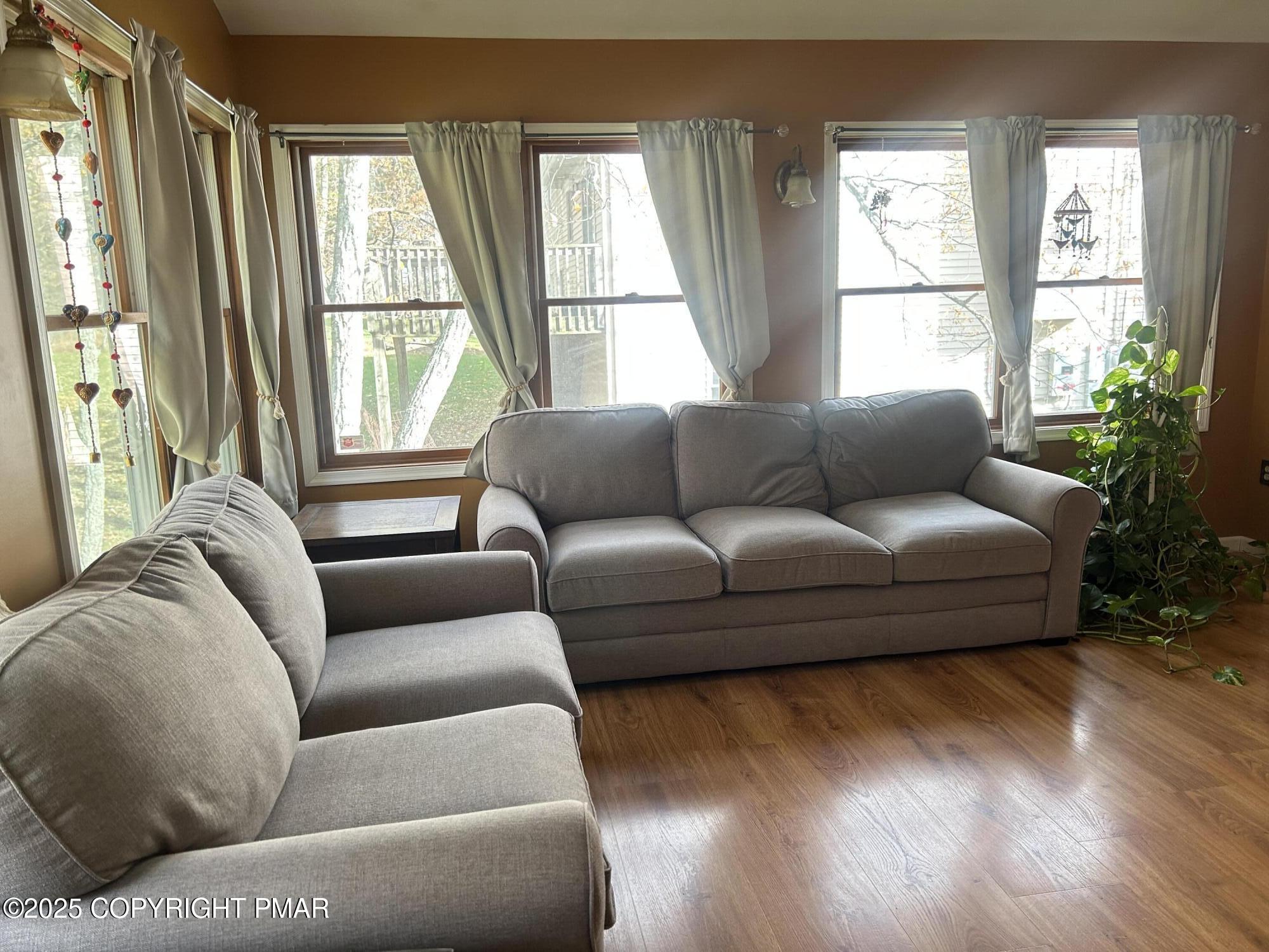 1152 Steele Circle Bushkill, PA 18324 - Photo 12 of 39 a living room with furniture and a large window