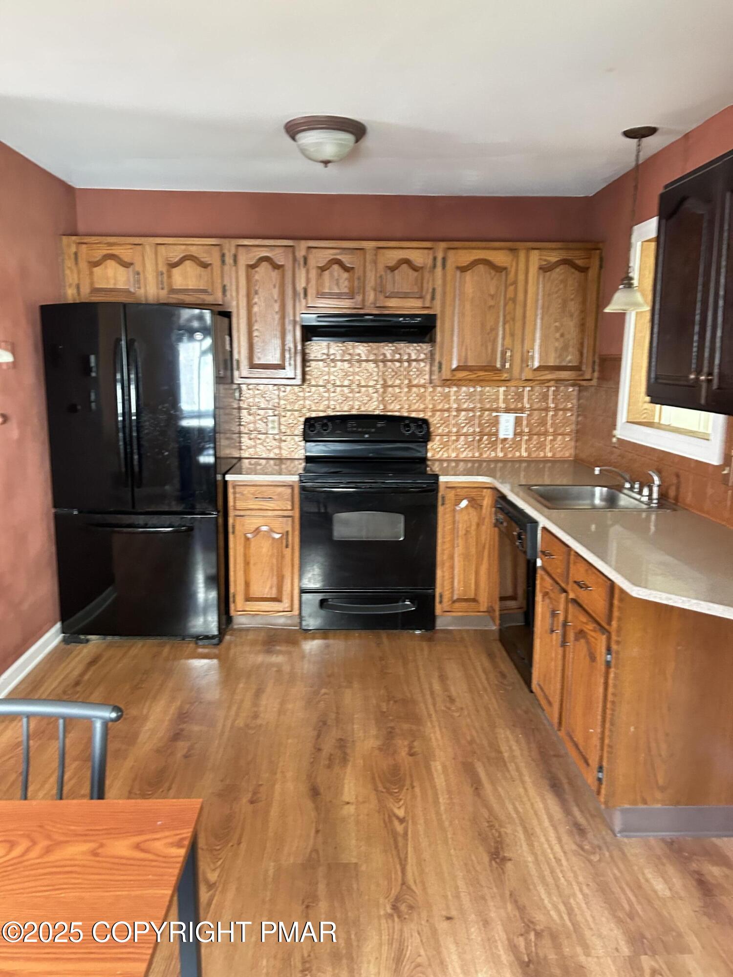 1152 Steele Circle Bushkill, PA 18324 - Photo 16 of 39 a kitchen with stainless steel appliances granite countertop a refrigerator and a stove