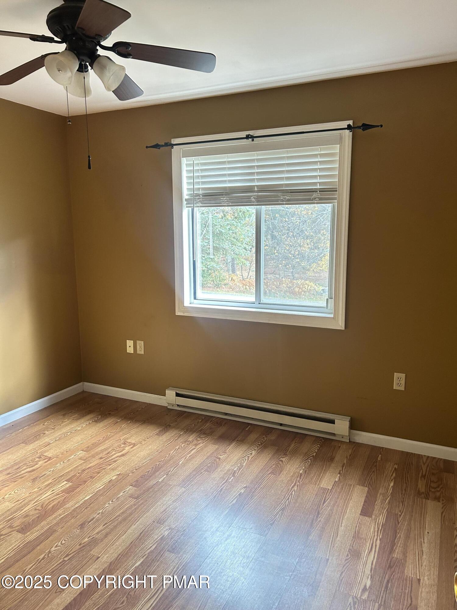 1152 Steele Circle Bushkill, PA 18324 - Photo 18 of 39 a view of an empty room with wooden floor and a window