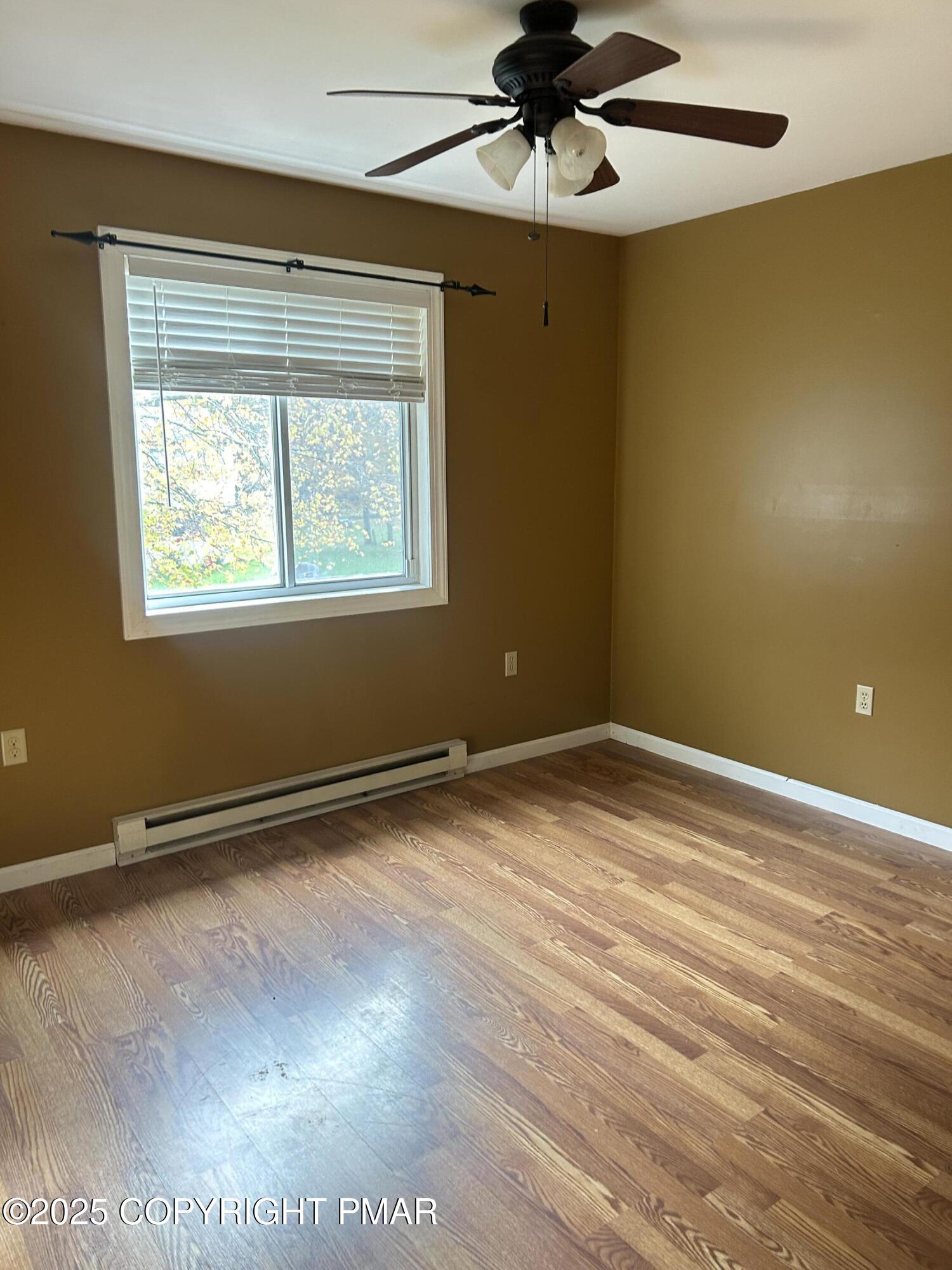 1152 Steele Circle Bushkill, PA 18324 - Photo 20 of 39 a view of an empty room with wooden floor and a window