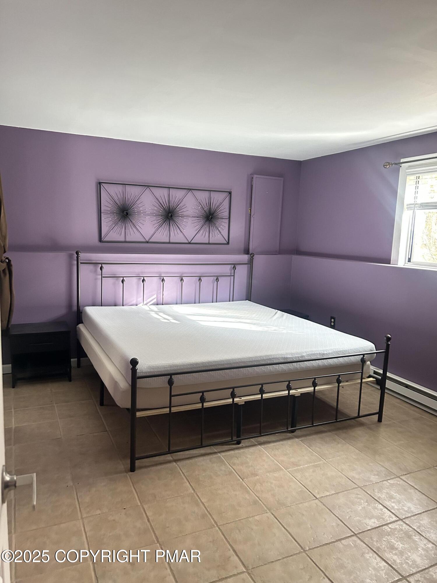 1152 Steele Circle Bushkill, PA 18324 - Photo 23 of 39 a bedroom with a bed and window