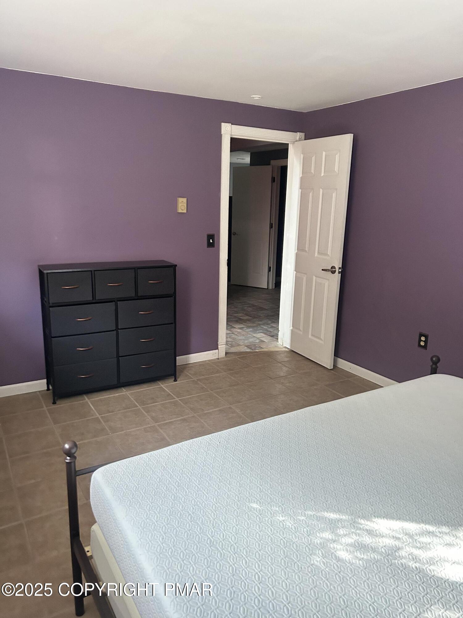 1152 Steele Circle Bushkill, PA 18324 - Photo 25 of 39 a bed room with a bed and a dresser