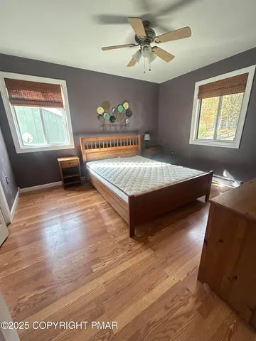 a spacious bedroom with a bed and a window