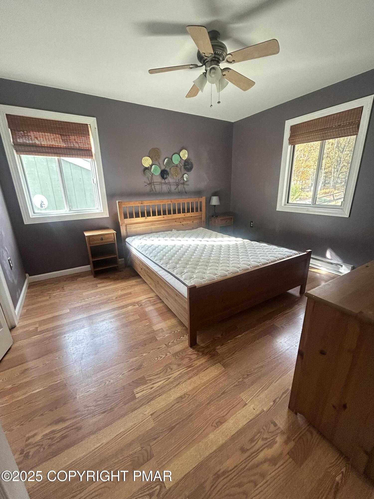 1152 Steele Circle Bushkill, PA 18324 - Photo 28 of 39 a spacious bedroom with a bed and a window