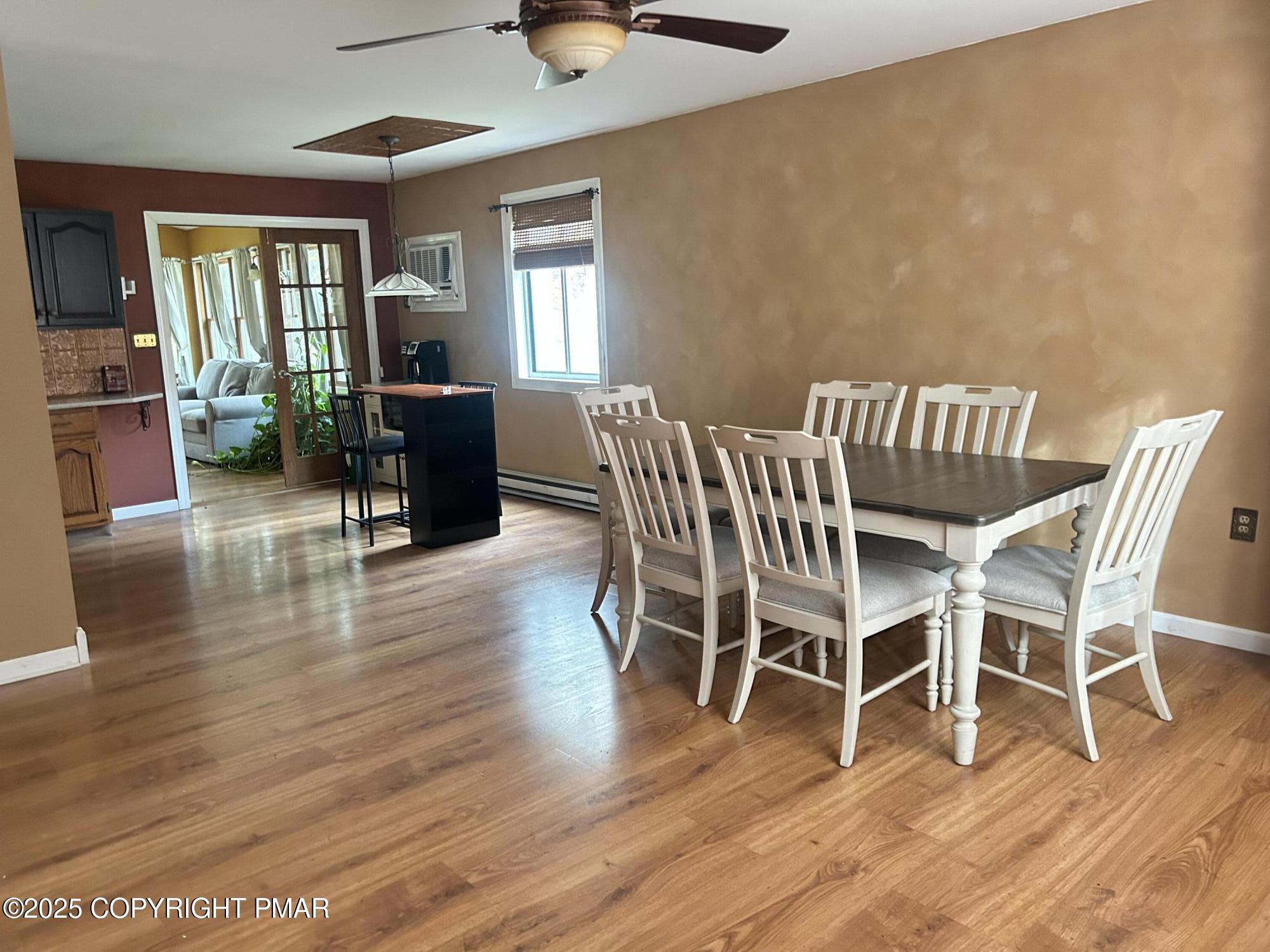 1152 Steele Circle Bushkill, PA 18324 - Photo 3 of 39 a view of a dining room with furniture window and wooden floor
