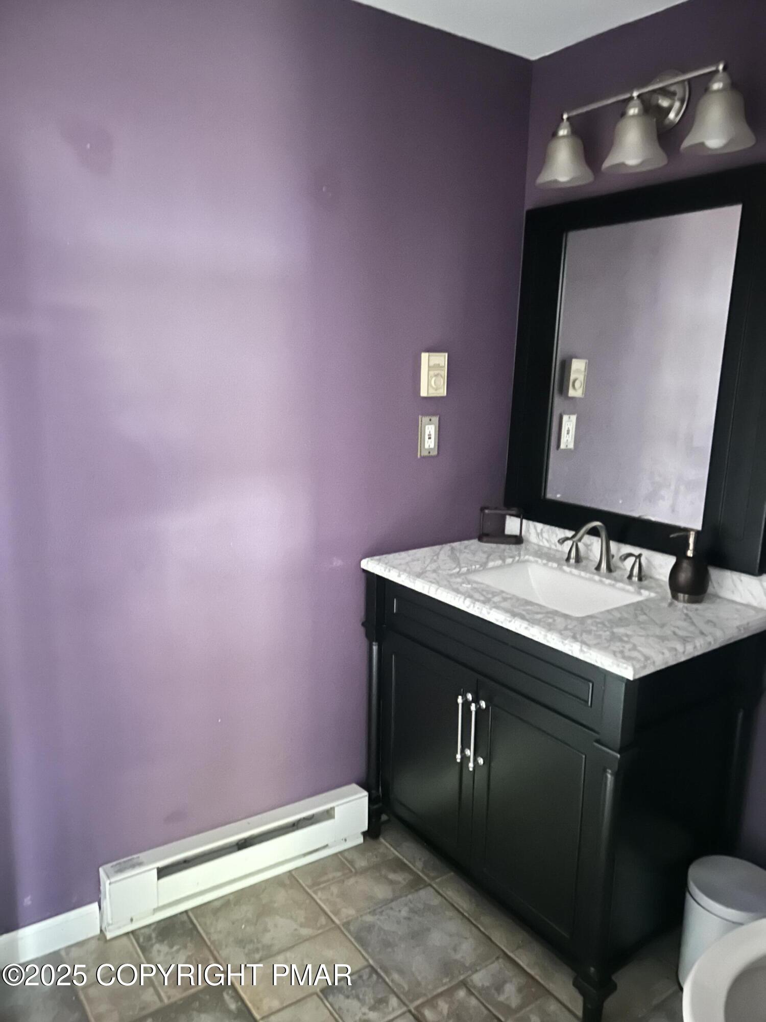 1152 Steele Circle Bushkill, PA 18324 - Photo 32 of 39 a bathroom with a sink and a mirror