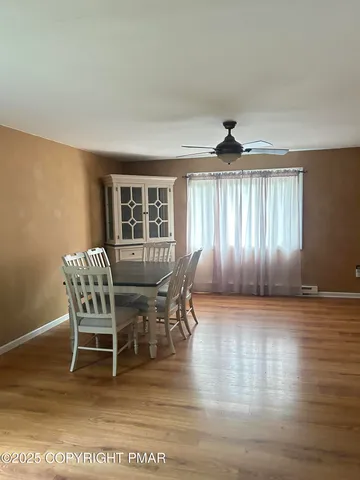 a view of a livingroom with furniture and wooden floor
