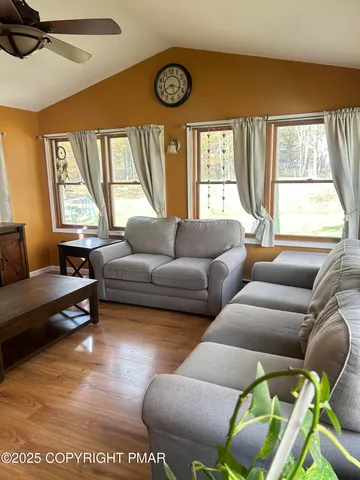 a living room with furniture and a large window