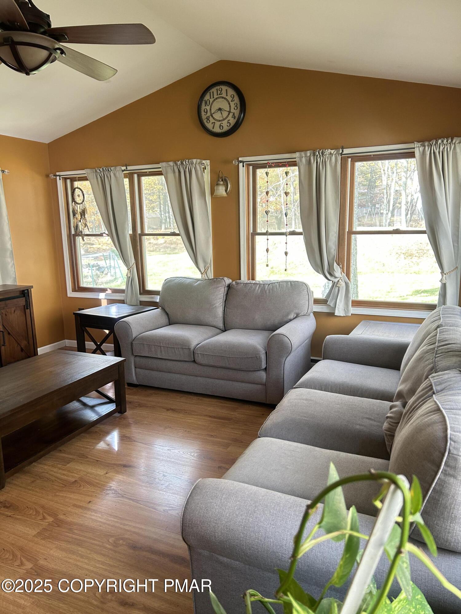 1152 Steele Circle Bushkill, PA 18324 - Photo 10 of 39 a living room with furniture and a large window