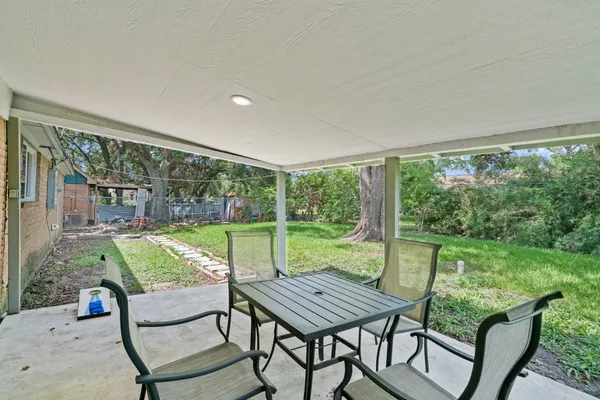 a view of a two chairs in the patio