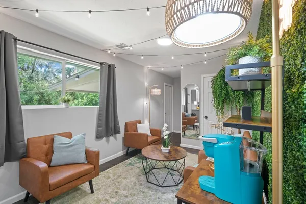 a living room with furniture and a large window