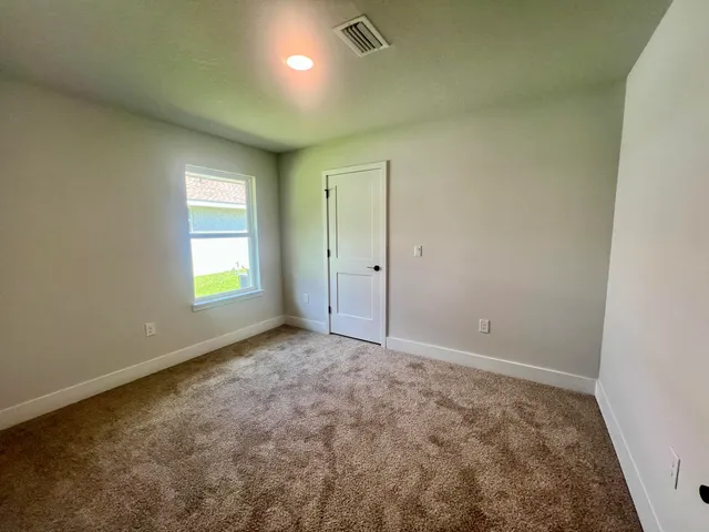 a kitchen with a refrigerator stove top oven and sink