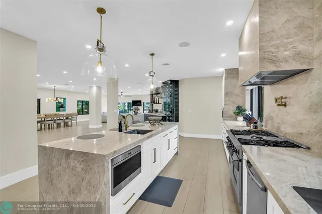 a view of a house with swimming pool and sitting area