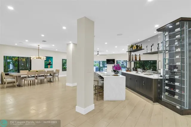 a view of a swimming pool with outdoor seating and city view