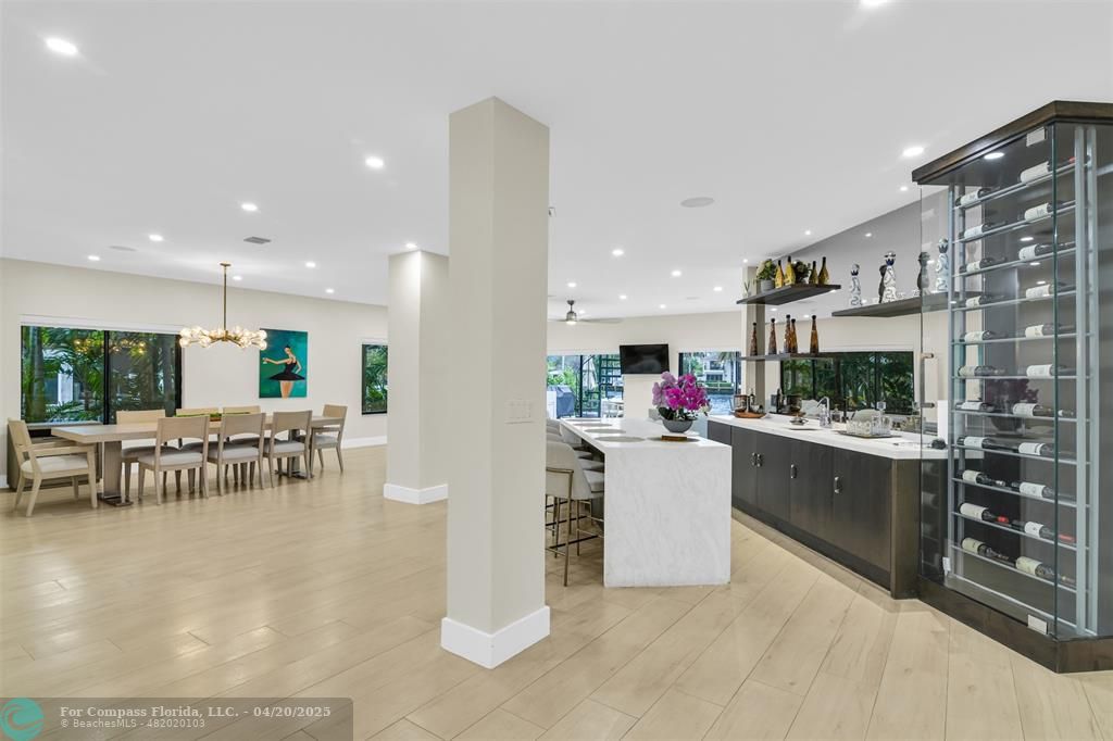 319 South Riverside Drive Pompano Beach, FL 33062 - Photo 20 of 98 a kitchen with a dining table and chairs