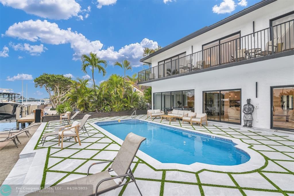 319 South Riverside Drive Pompano Beach, FL 33062 - Photo 35 of 98 a view of a house with swimming pool and sitting area