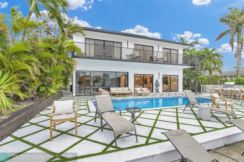 319 South Riverside Drive Pompano Beach, FL 33062 - Photo 39 of 98 a view of a house with backyard porch and patio