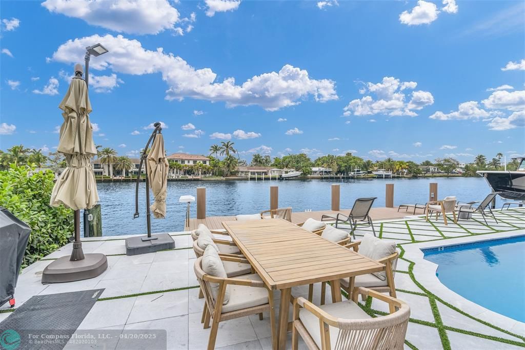 319 South Riverside Drive Pompano Beach, FL 33062 - Photo 43 of 98 a view of a terrace with furniture and stove