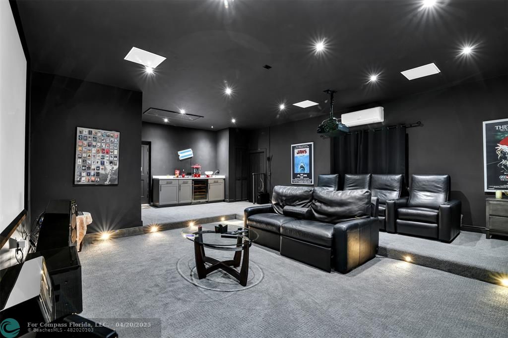 319 South Riverside Drive Pompano Beach, FL 33062 - Photo 50 of 98 a living room with furniture and a flat screen tv