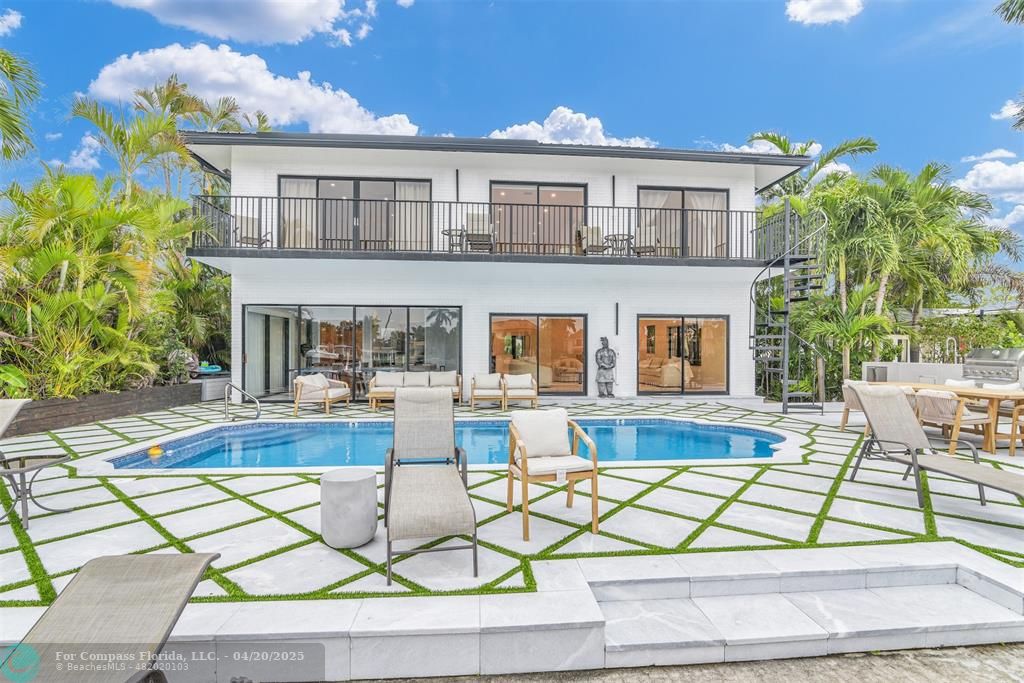 319 South Riverside Drive Pompano Beach, FL 33062 - Photo 5 of 98 a view of house with outdoor seating