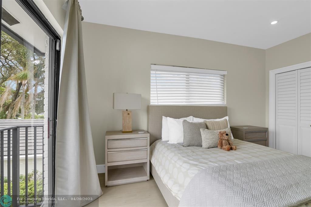 319 South Riverside Drive Pompano Beach, FL 33062 - Photo 73 of 98 a bedroom with a bed and a window