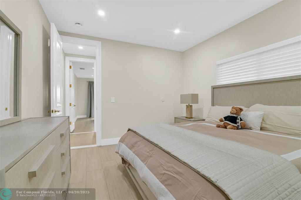 319 South Riverside Drive Pompano Beach, FL 33062 - Photo 79 of 98 a bedroom with a bed and a cabinets