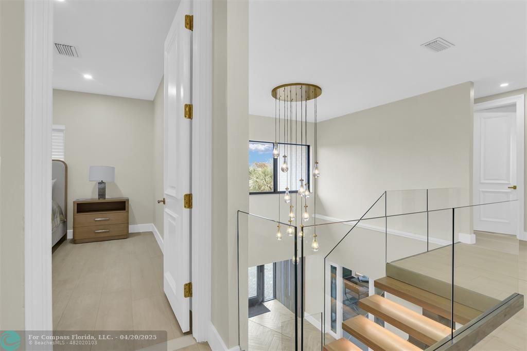 319 South Riverside Drive Pompano Beach, FL 33062 - Photo 81 of 98 a view of hallway with furniture and wooden floor