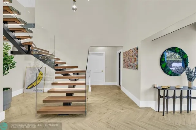 a kitchen with stainless steel appliances granite countertop a sink a stove and refrigerator