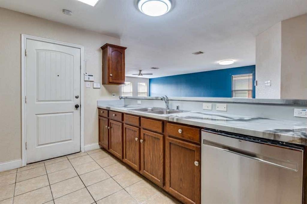 2118 Augusta Street Lancaster, TX 75146 - Photo 13 of 25 a kitchen with stainless steel appliances granite countertop a sink and a stove