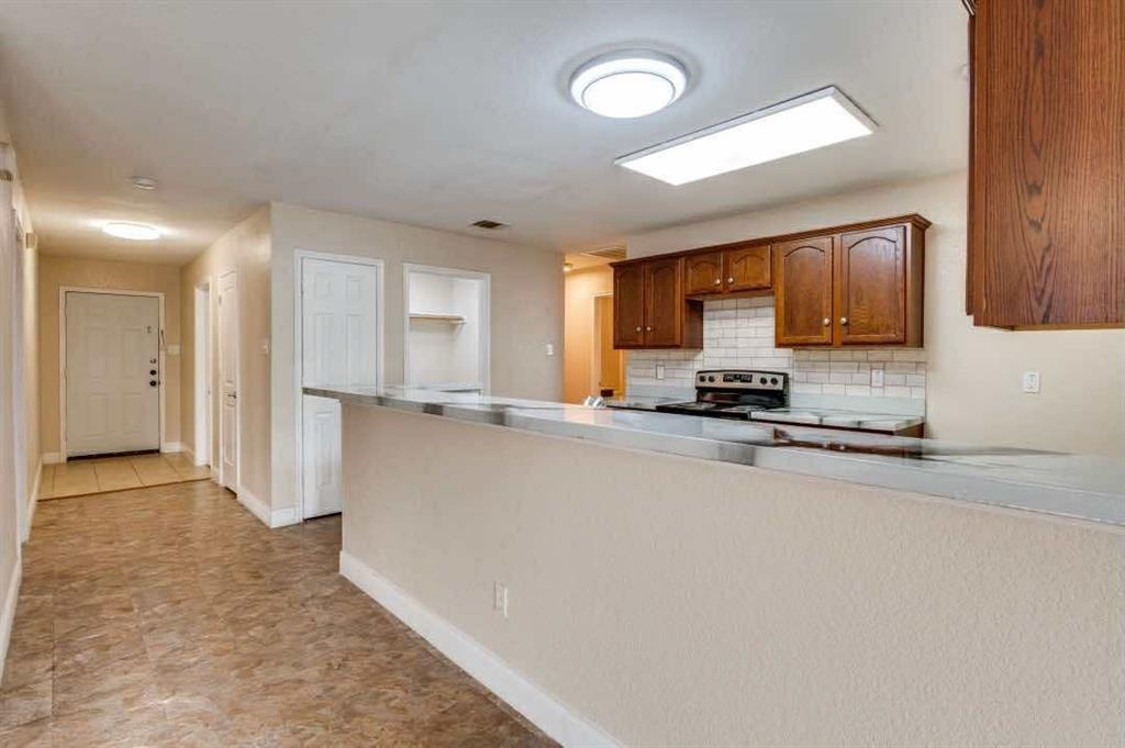 2118 Augusta Street Lancaster, TX 75146 - Photo 15 of 25 a view of a kitchen with a sink and cabinets