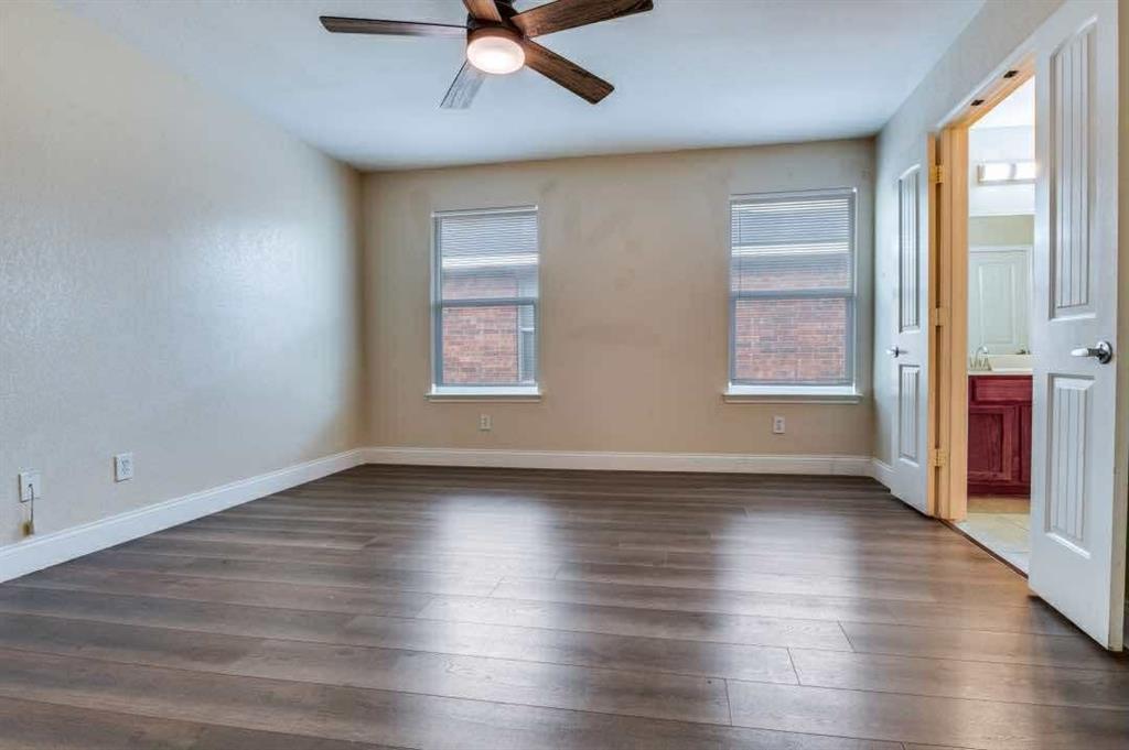 2118 Augusta Street Lancaster, TX 75146 - Photo 17 of 25 an empty room with wooden floor and windows
