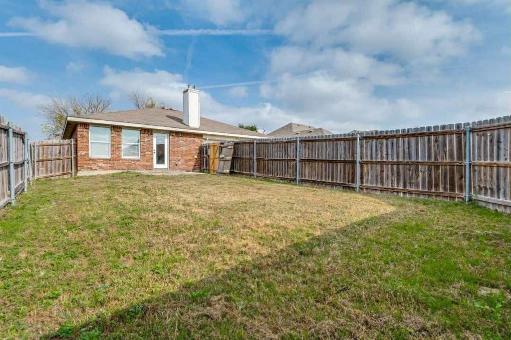 2118 Augusta Street Lancaster, TX 75146 - Photo 23 of 25 a view of a house with a yard and sitting area