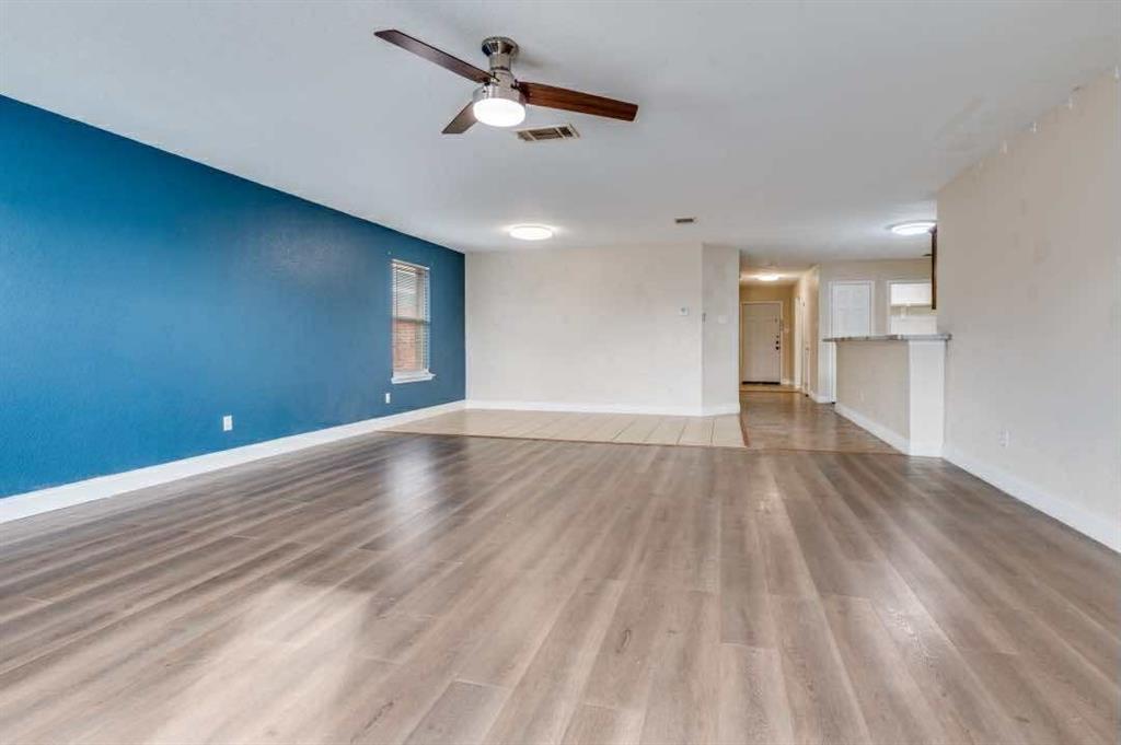 2118 Augusta Street Lancaster, TX 75146 - Photo 5 of 25 a view of empty room with wooden floor and ceiling fan