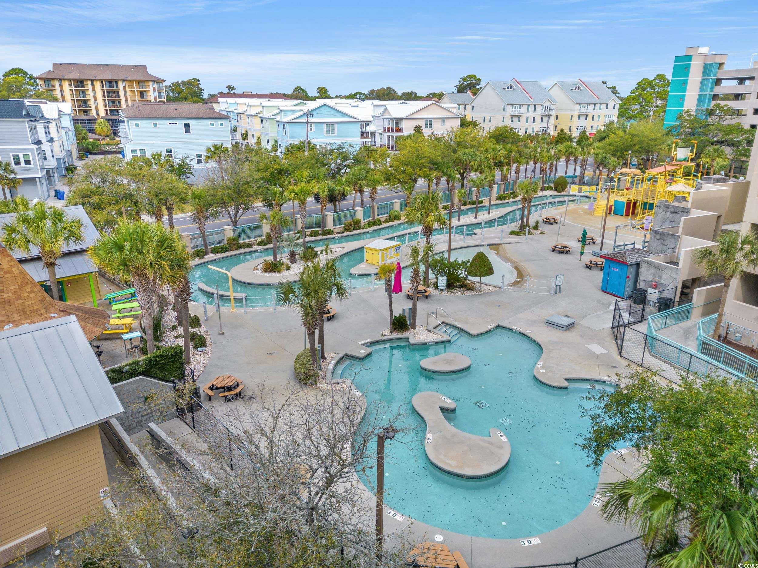 201N 74th Avenue North, Unit 601 Myrtle Beach, SC 29572 - Photo 31 of 35 View of home's community with a swimming pool and a residential view