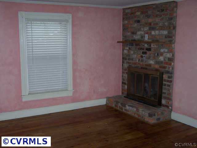 402 Henry Clay Road Ashland, VA 23005 - Photo 2 of 2 Other - Master Bedroom has brick fireplace and wal