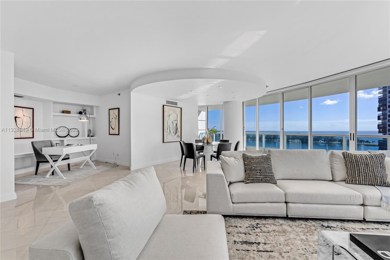 2127 Brickell Avenue, Unit 1402 Miami, FL 33129 - Photo 1 of 35 a living room with furniture and a couch