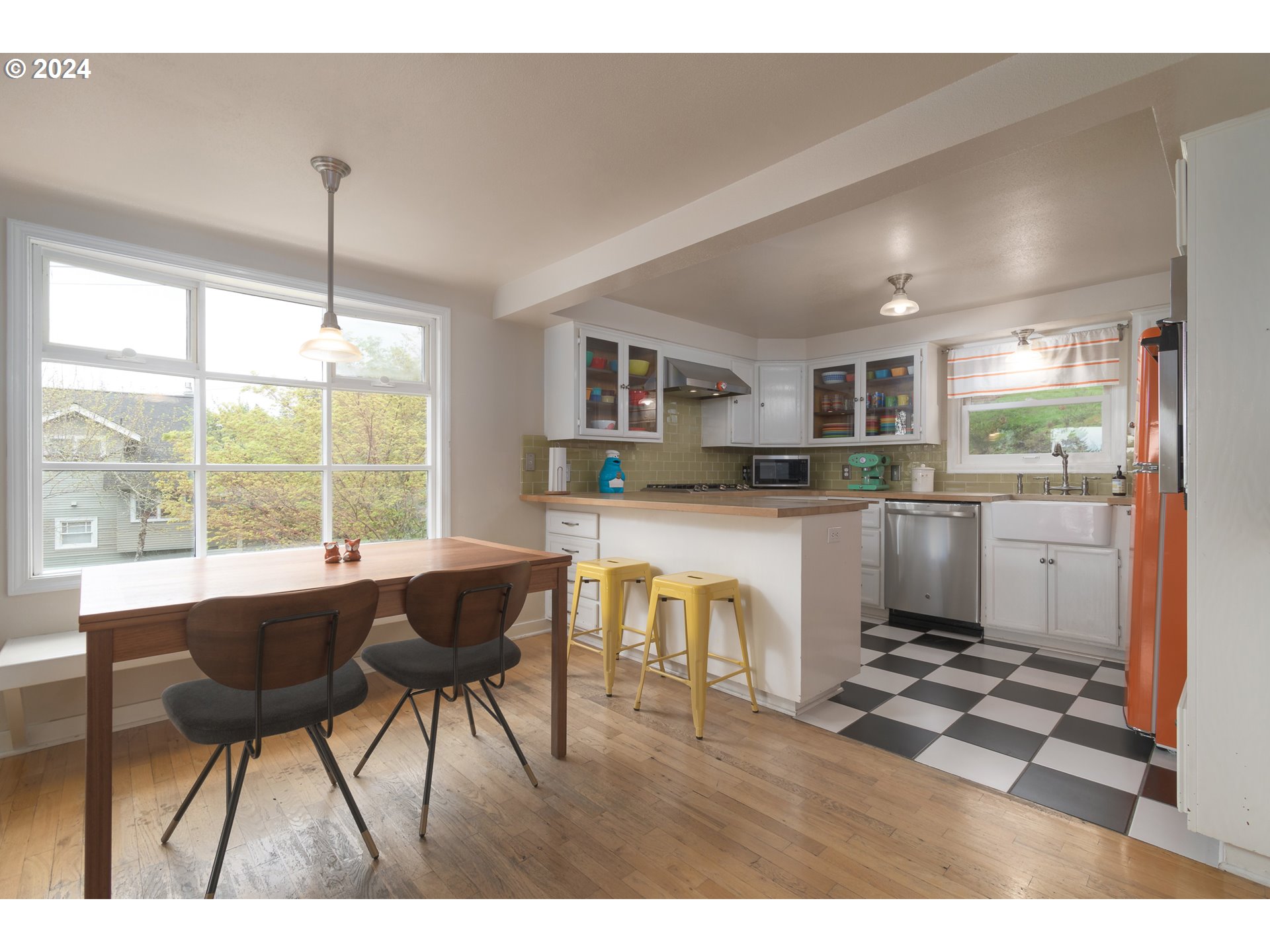 2614 Van Ness Street Eugene, OR 97403 - Photo 11 of 38 a kitchen with a table chairs refrigerator and cabinets