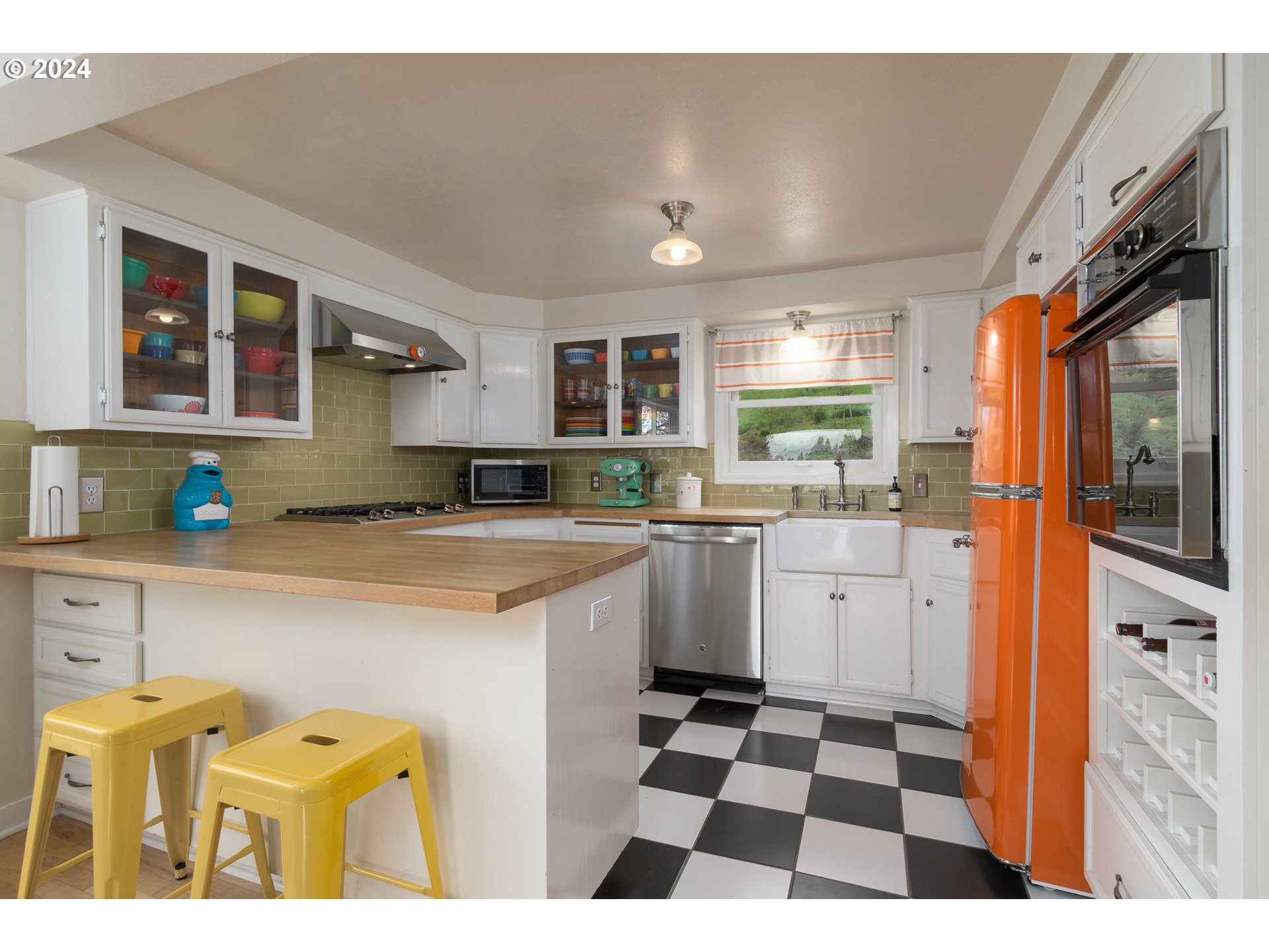 2614 Van Ness Street Eugene, OR 97403 - Photo 12 of 38 a kitchen with a sink a stove a refrigerator and cabinets