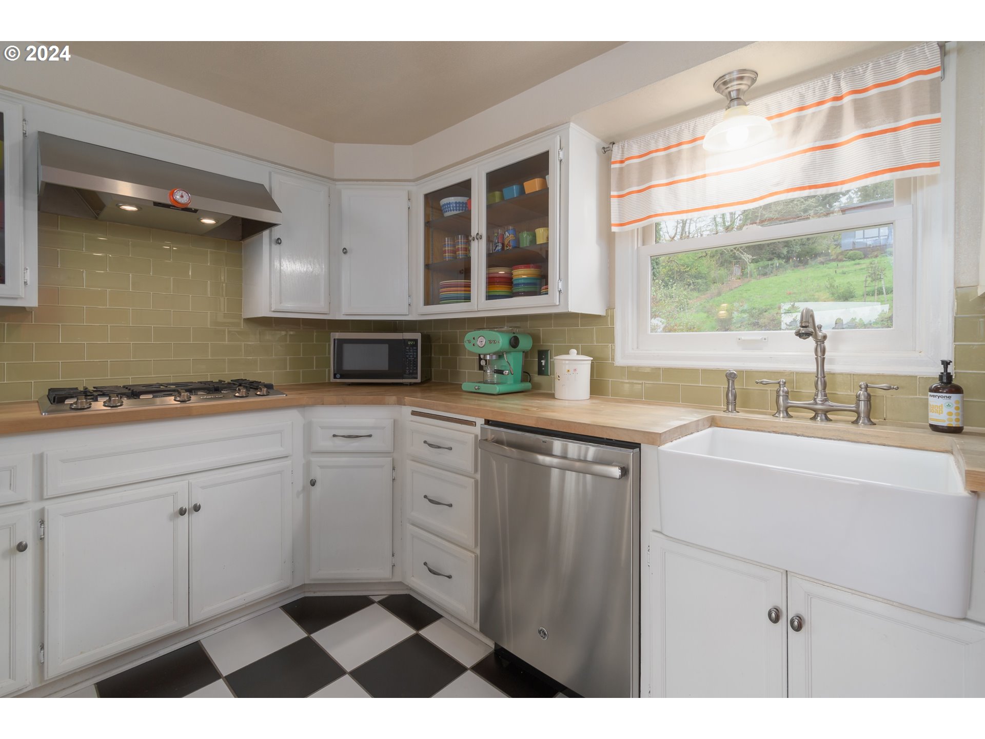 2614 Van Ness Street Eugene, OR 97403 - Photo 13 of 38 a kitchen with a sink cabinets and a window