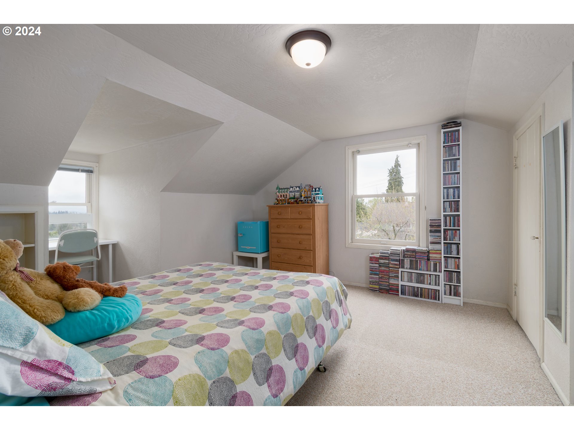 2614 Van Ness Street Eugene, OR 97403 - Photo 20 of 38 a bedroom with a bed dresser and a window