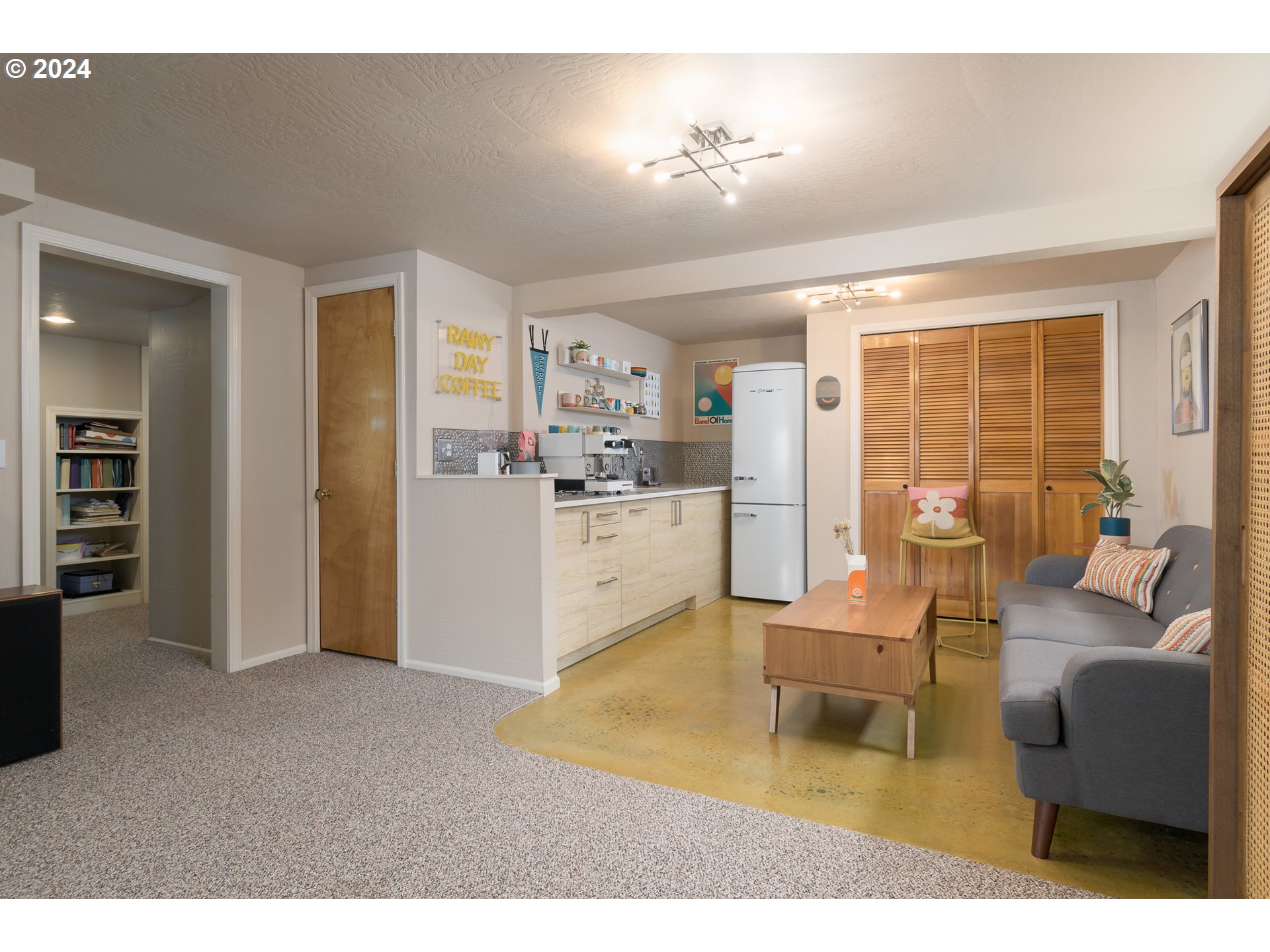 2614 Van Ness Street Eugene, OR 97403 - Photo 24 of 38 a living room with furniture and a kitchen