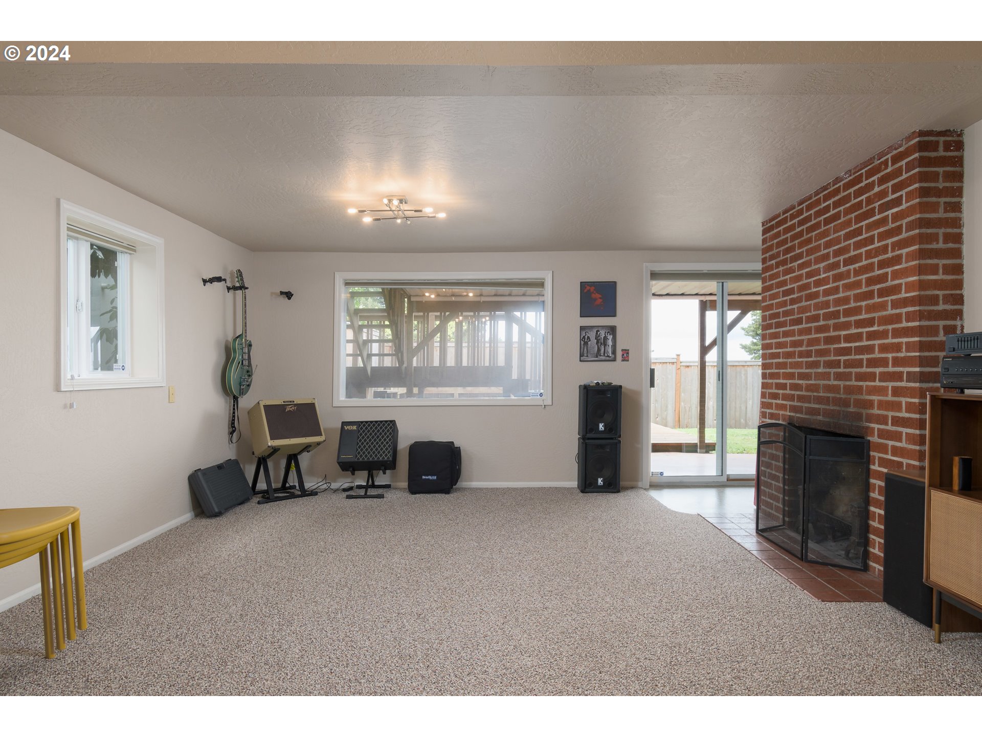 2614 Van Ness Street Eugene, OR 97403 - Photo 27 of 38 a living room with furniture and a fireplace