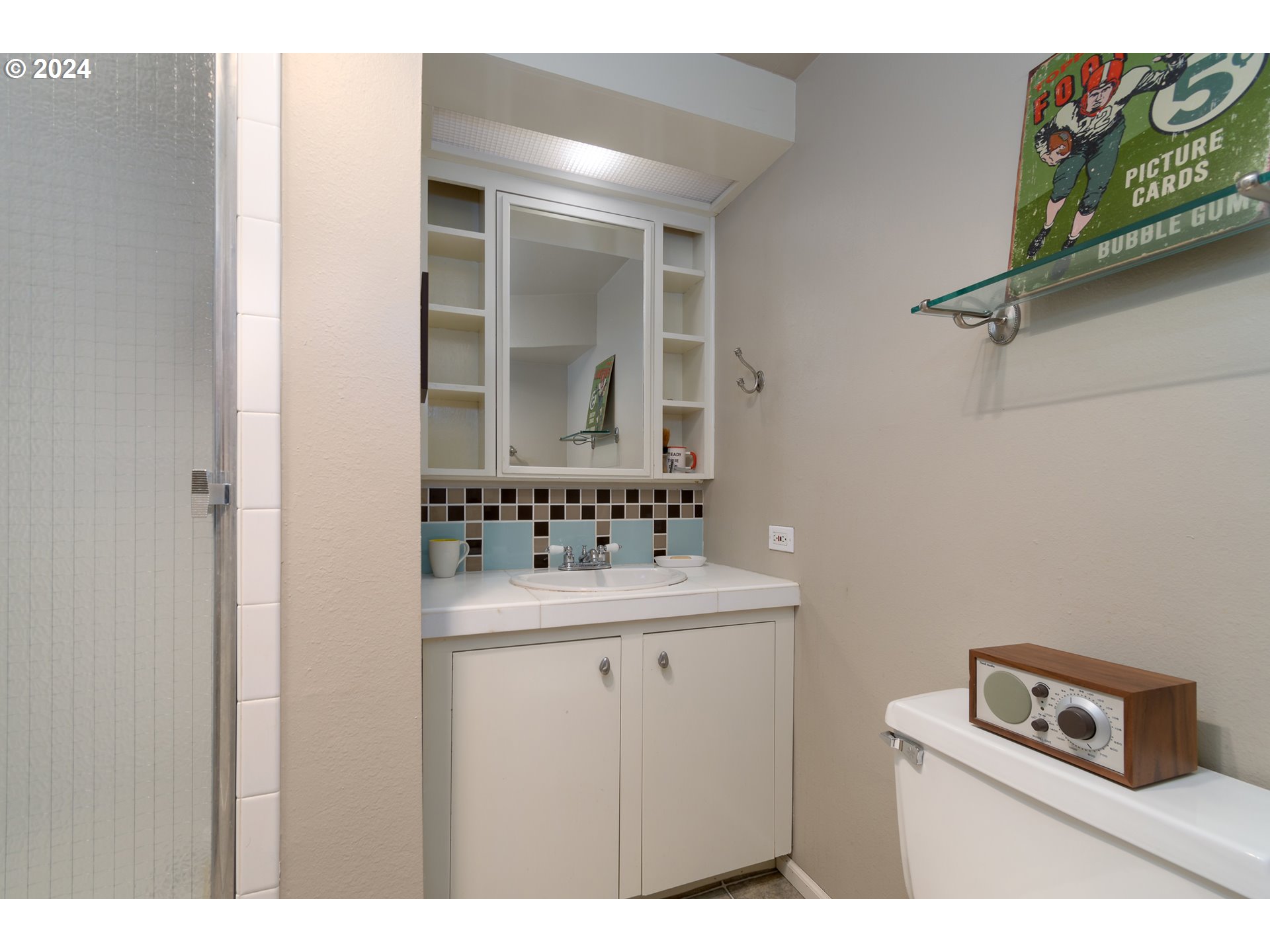 2614 Van Ness Street Eugene, OR 97403 - Photo 29 of 38 a bathroom with a sink and a mirror